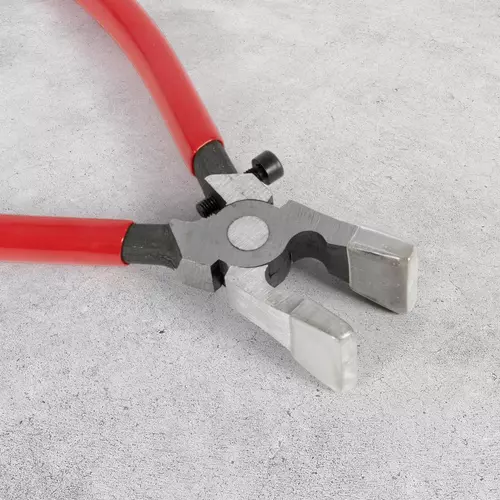 Glass-breaking pliers with an adjustable clamping screw